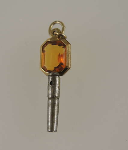 Gold cased and orange glass set pocket watch key c1850