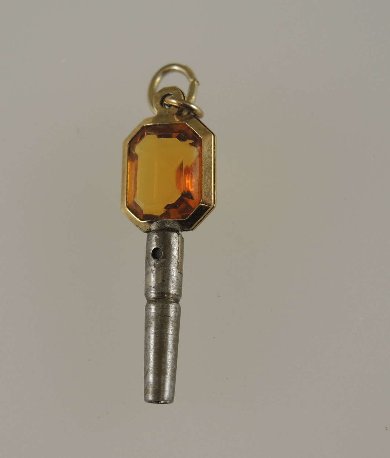 Gold cased and orange glass set pocket watch key c1850