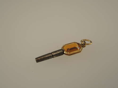 Gold cased and orange glass set pocket watch key c1850