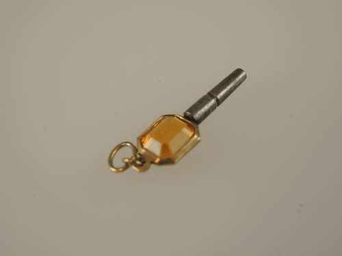 Gold cased and orange glass set pocket watch key c1850