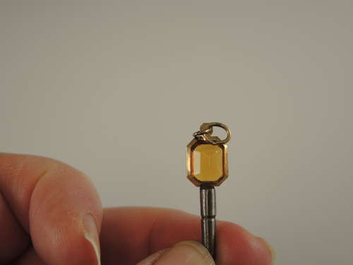 Gold cased and orange glass set pocket watch key c1850