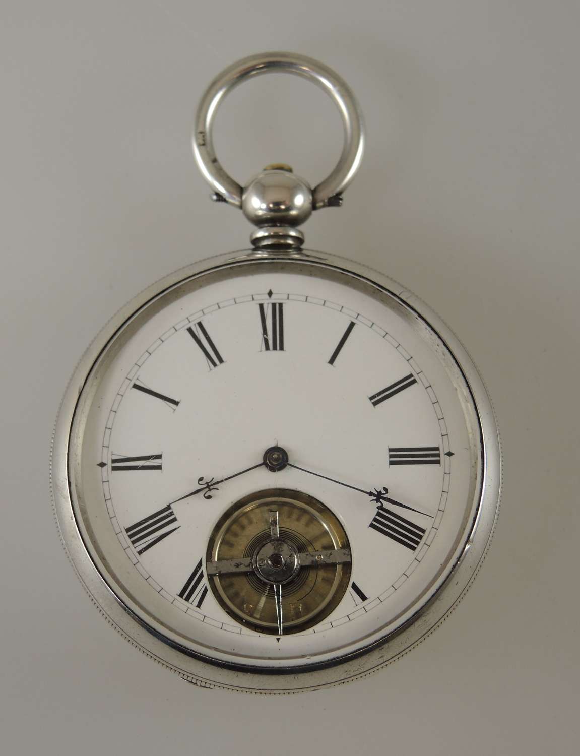 Unusual silver pocket watch with inverted visible balance c1870
