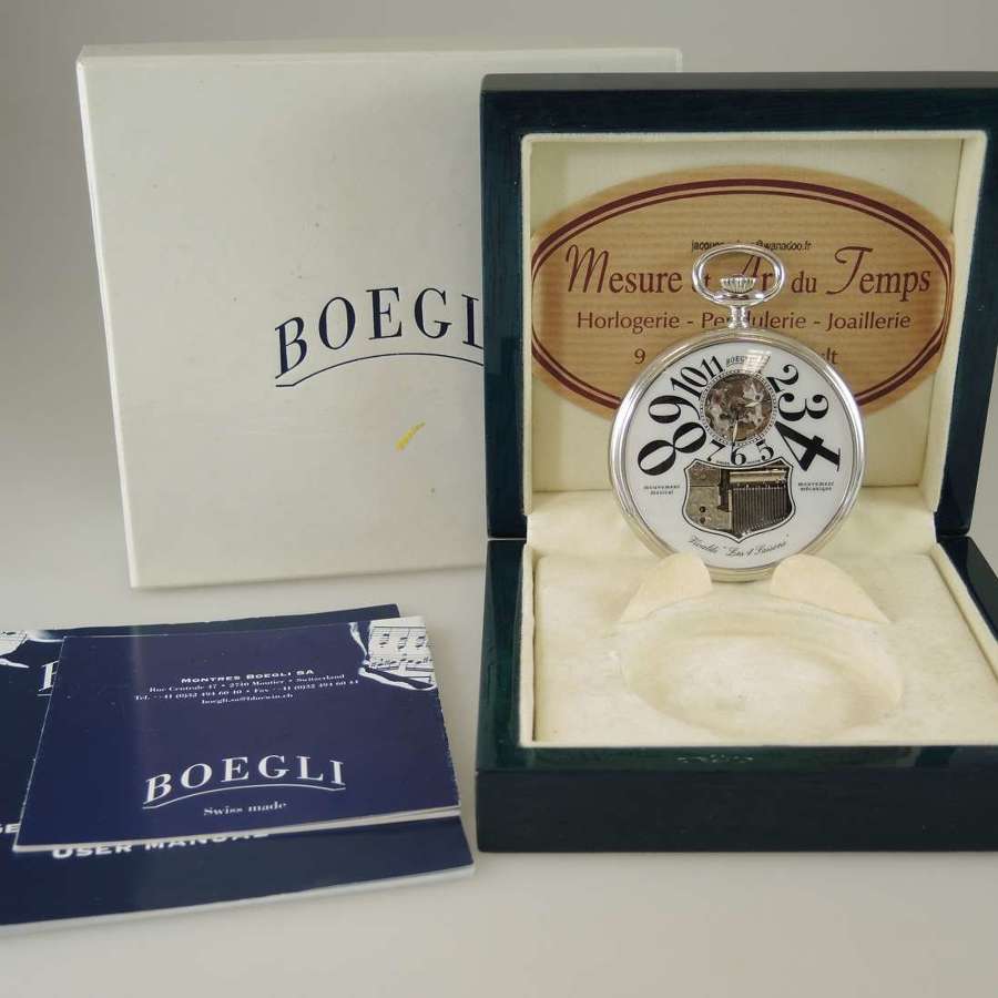 Musical pocket watch by Boegli. Boxed with papers and tag.