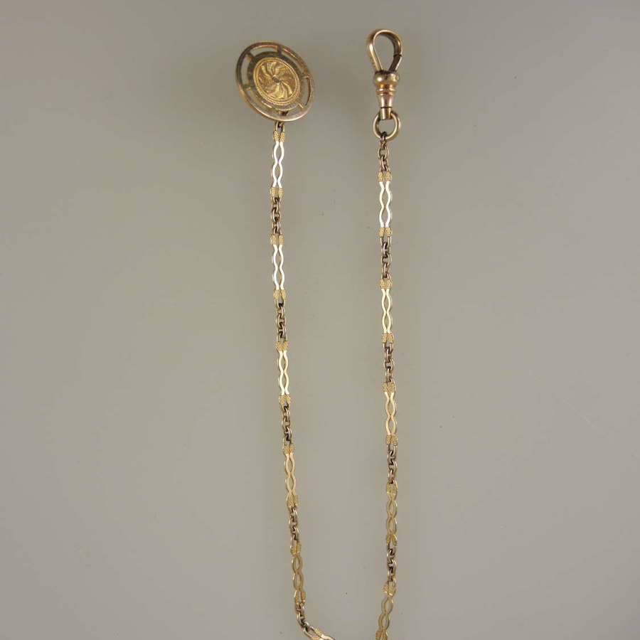 Elegant gold plated pocket watch chain for a blazer pocket c1910