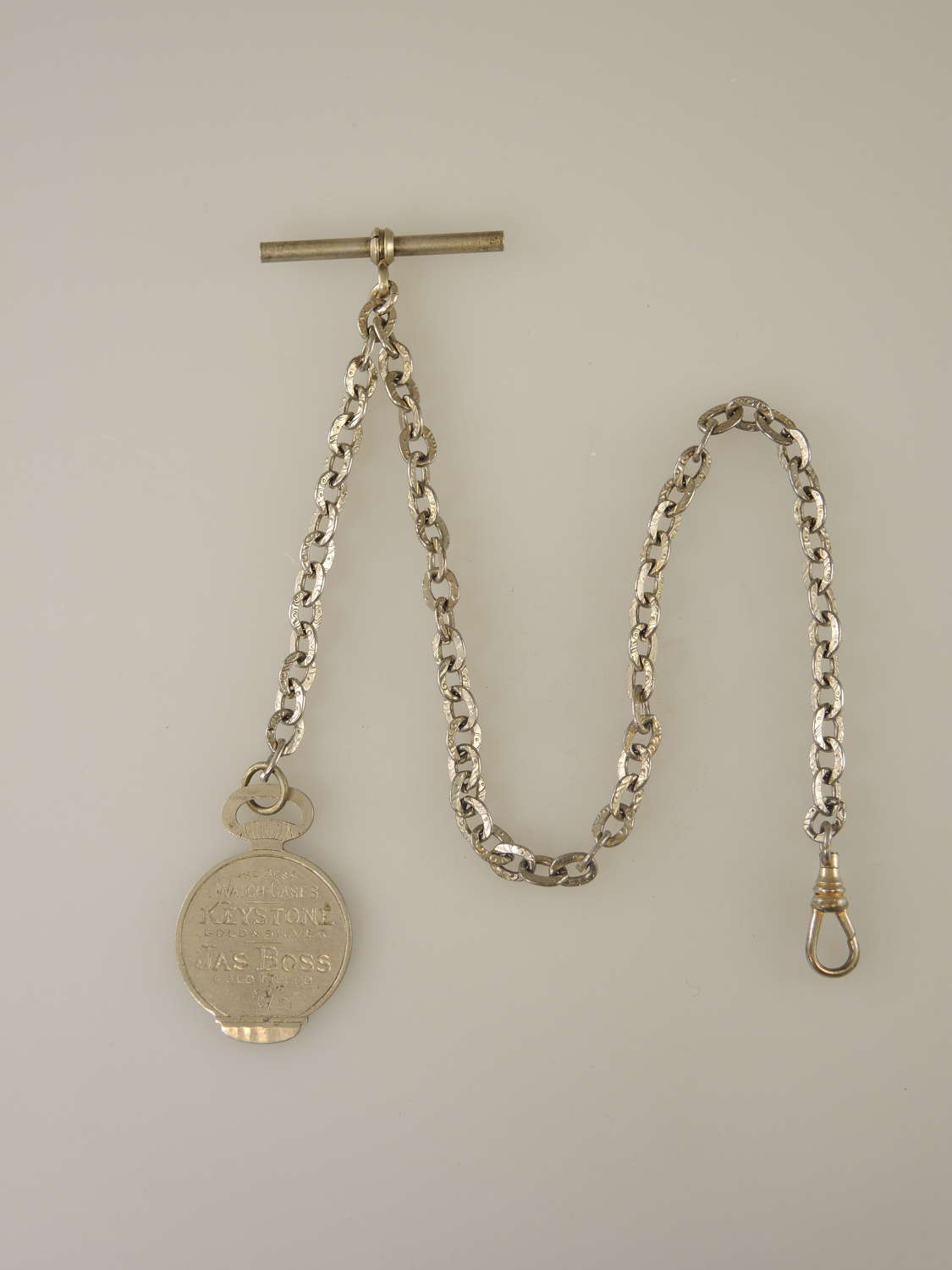 White metal pocket watch chain with Keystone case opener c1880