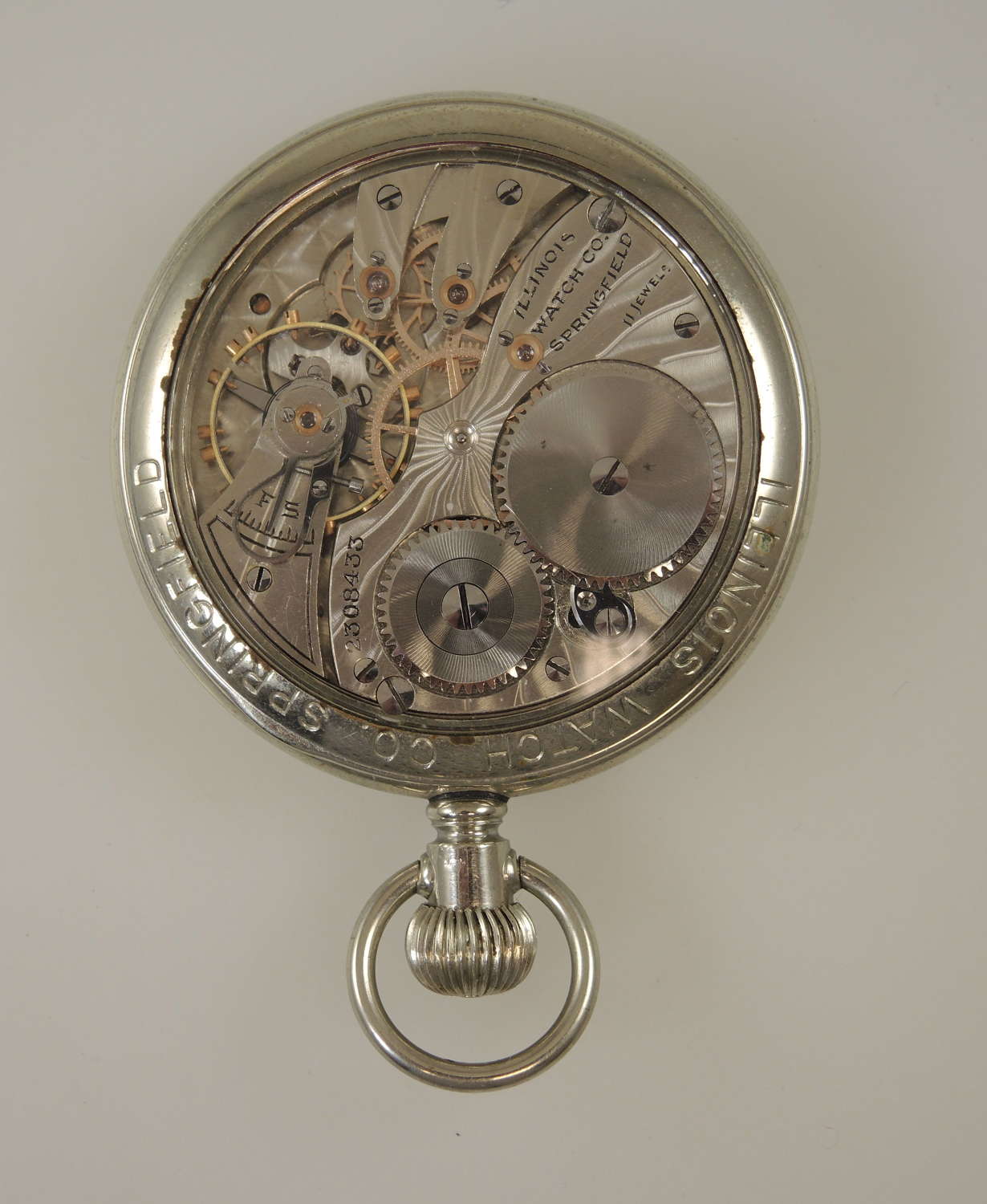 Vintage pocket watch by Illinois in a display case c1910