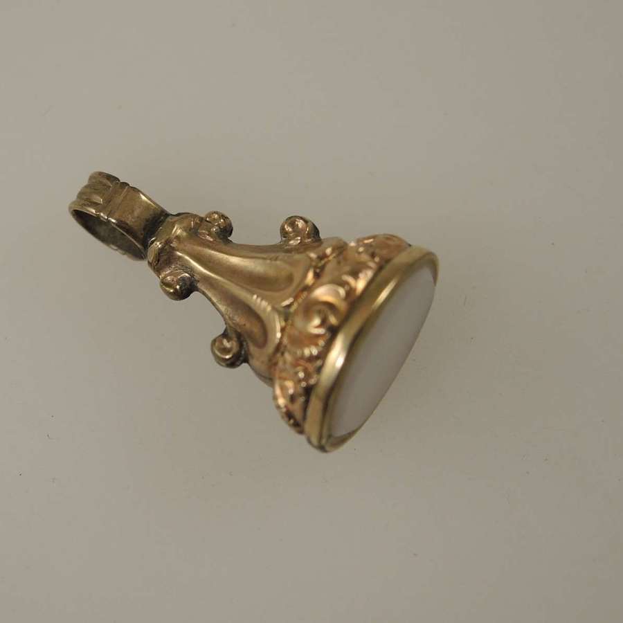 Small gold case and white stone seal. Charm size c1850