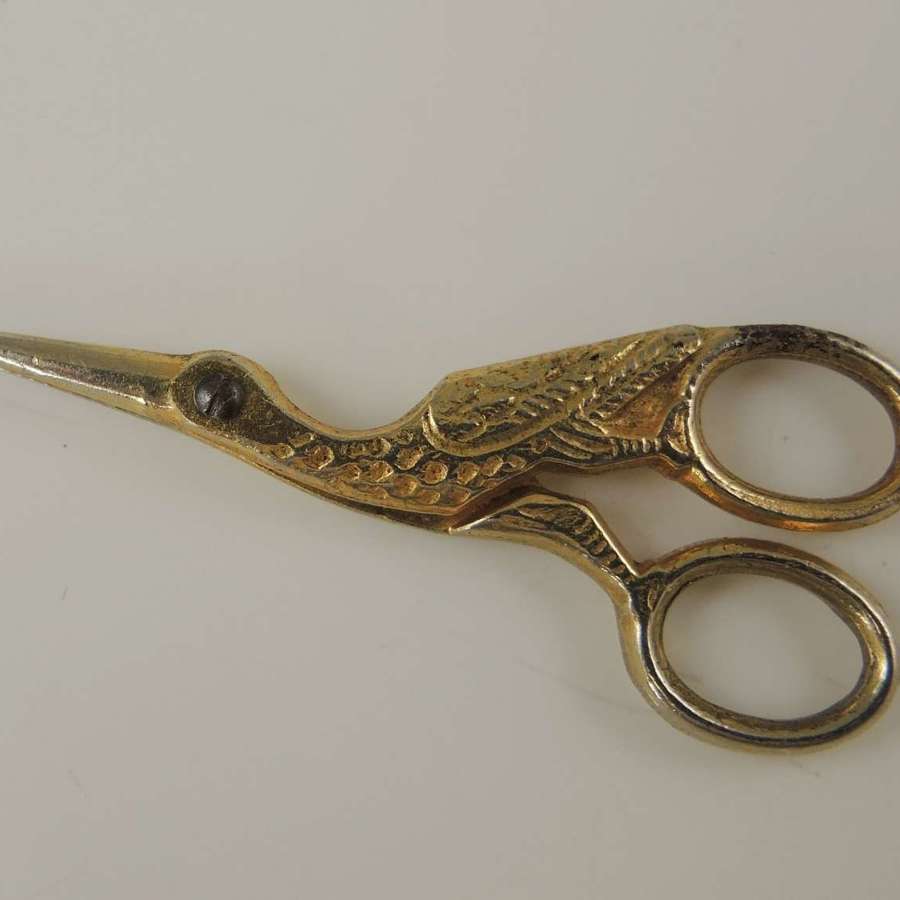 Unusual miniature gilt sewing scissors in the shape of a stork c1910