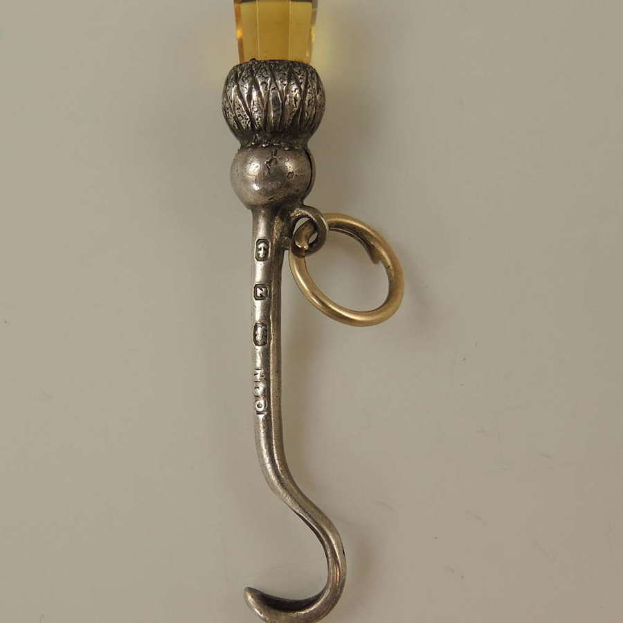 Unusual miniature silver button hook with citrine thistle c1899