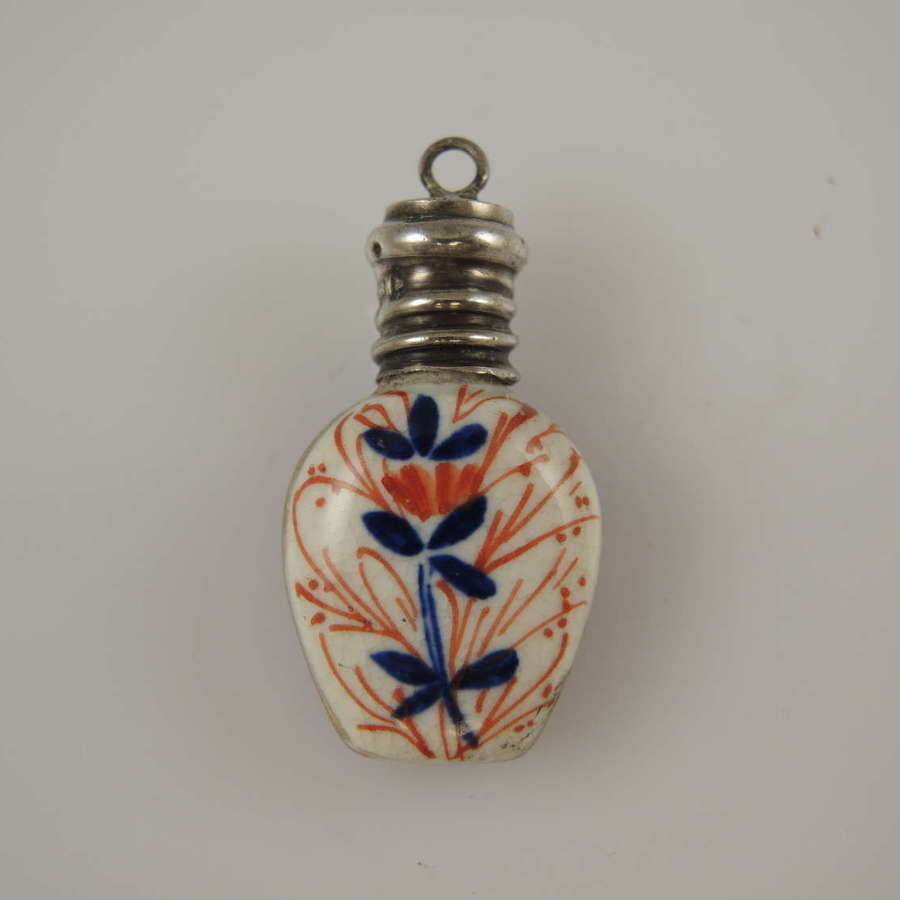 Miniature porcelain and silver topped scent bottle c1878