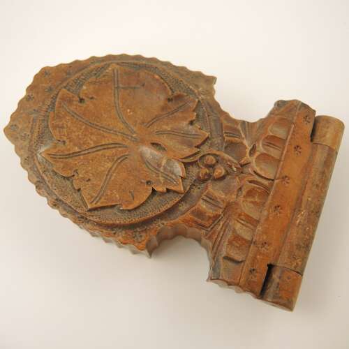 Black Forest watch stand with a carved oak leaf c1890