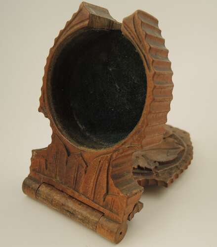 Black Forest watch stand with a carved oak leaf c1890